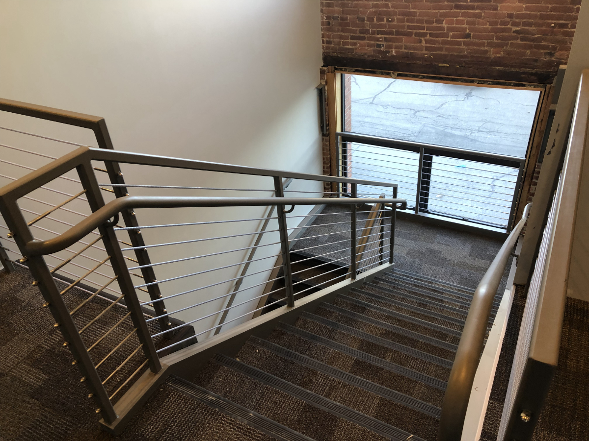 Interior Pan Stairs with Cable Guardrails and Offset Handrails